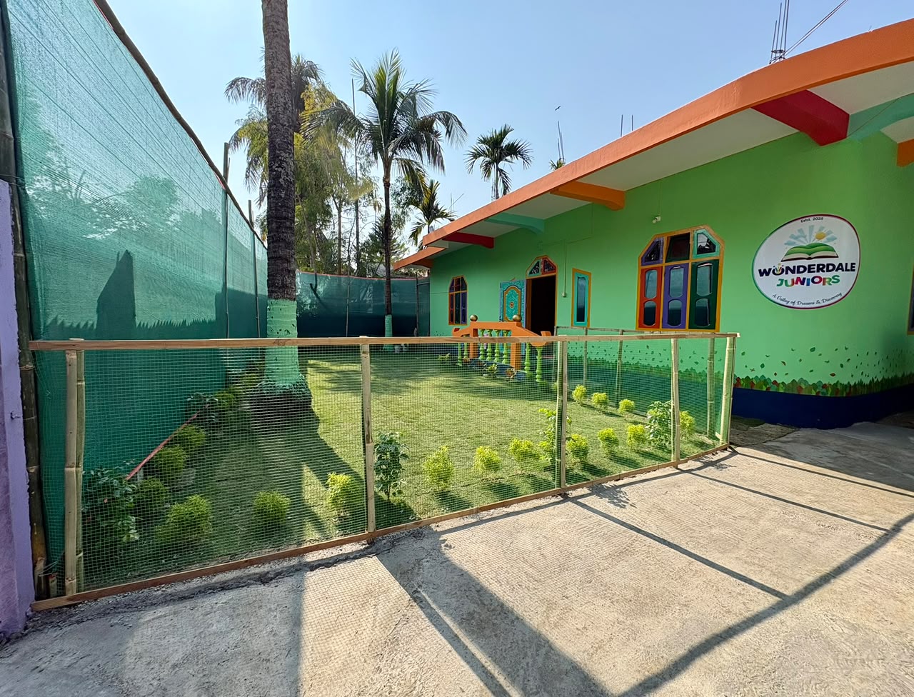 Wonderdale Juniors Green Campus Building and Fenced Play Lawn